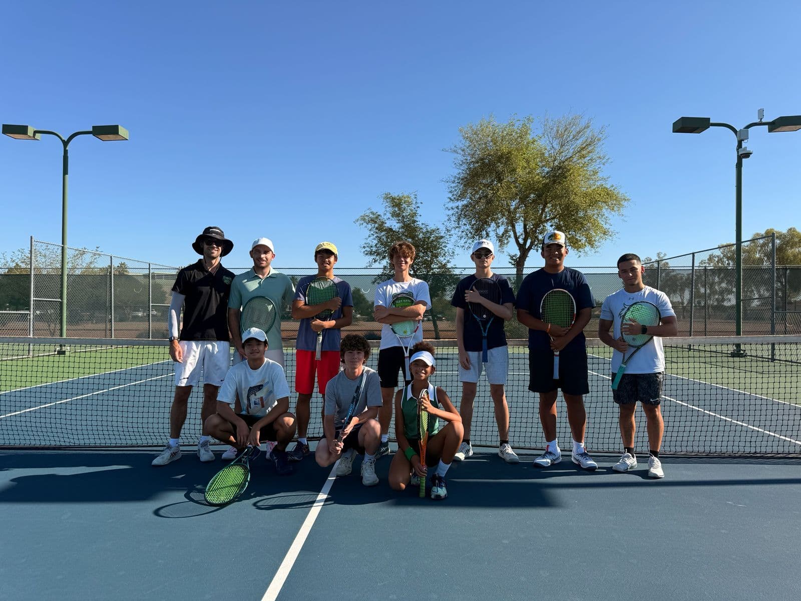 Man playing tennis at an academy